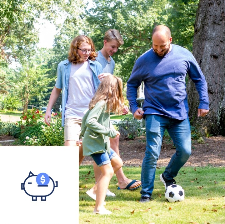 After figuring out some savings goals with our calculator, a family kicks a soccer ball together outside