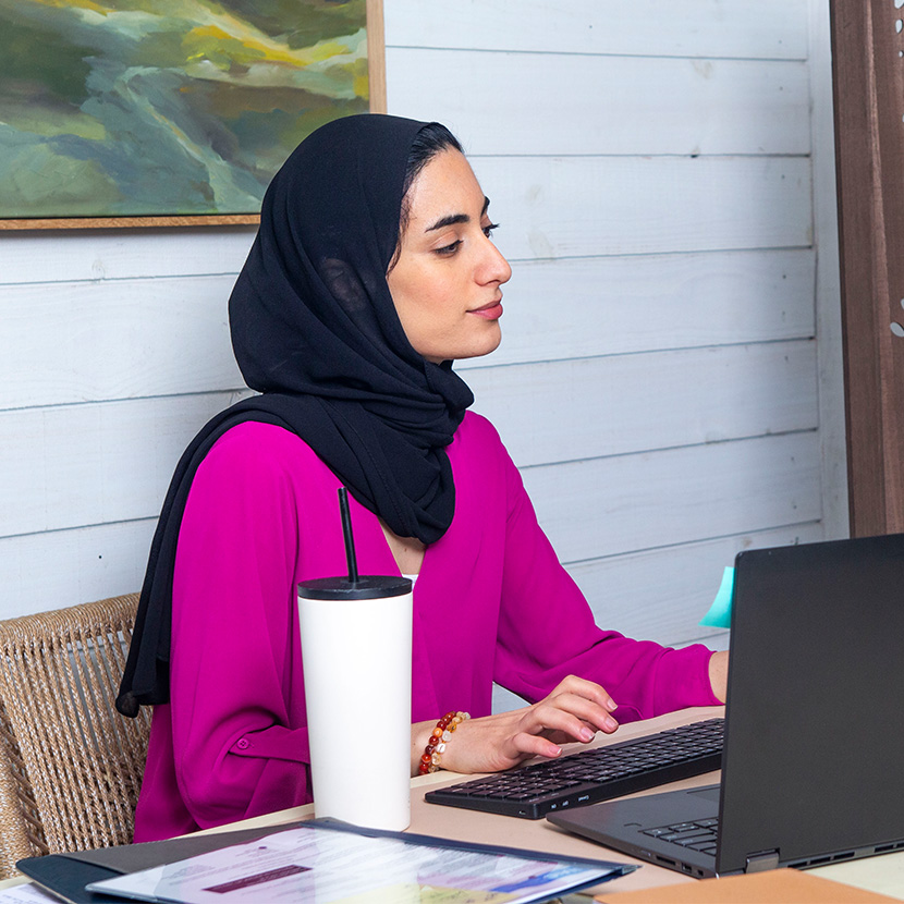 Female lending leader reviewing TruStage payment protection documentation.