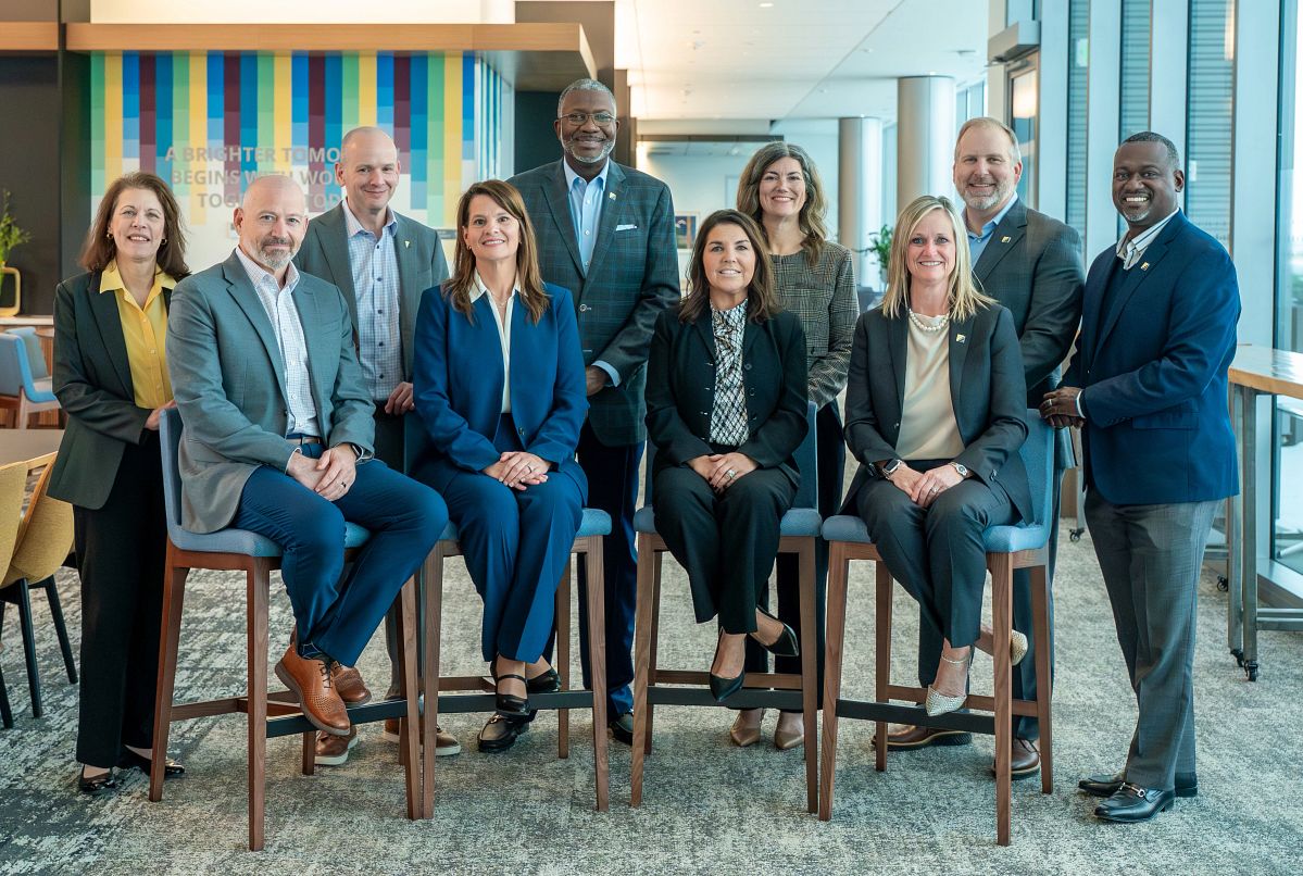 The TruStage executive leadership team gathers for a group photo.