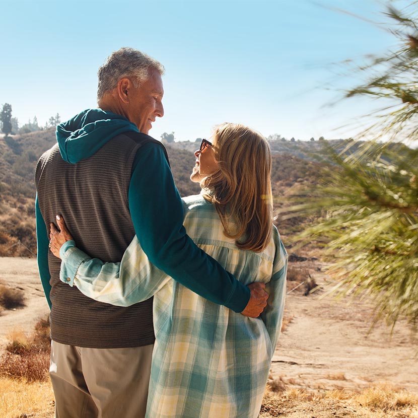 A man and woman outdoors thinking about their retirement which includes ZoneChoice Advantage Annuity from TruStage