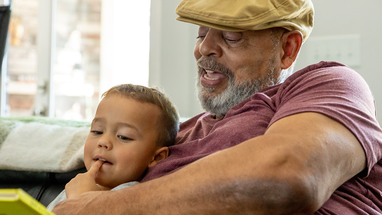 A grandfather reviews his Horizon II annuity performance with his grandson 