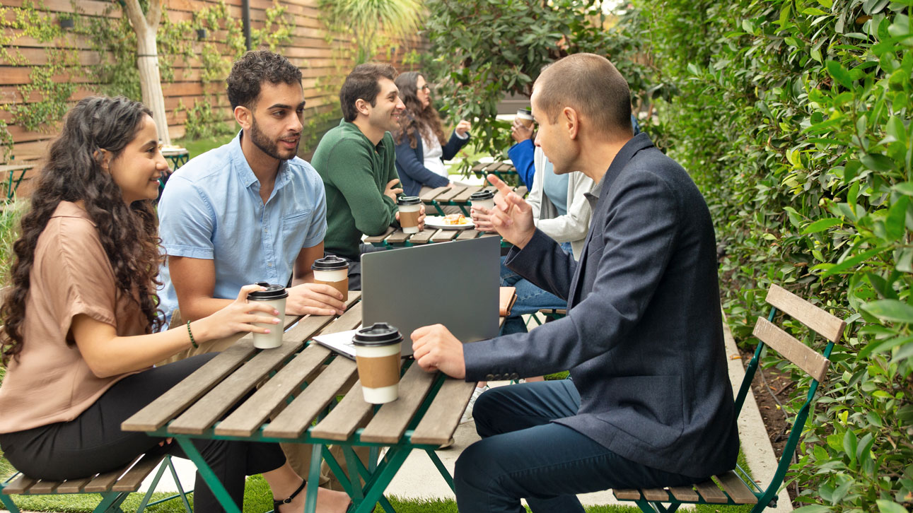 Group of people sitting around talking about TruStage's business protection resources