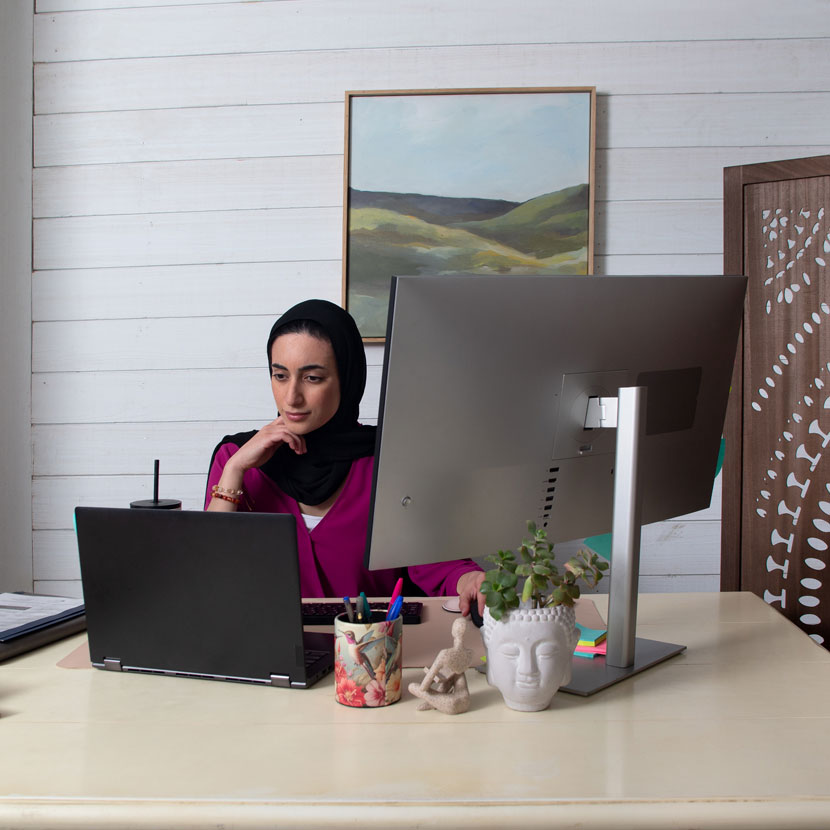 A woman researches TruStage Payment Guard cash advance on her computer