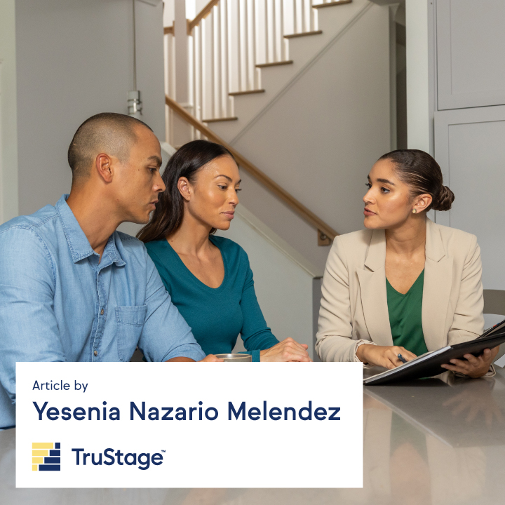A Latino couple talking with a financial advisor