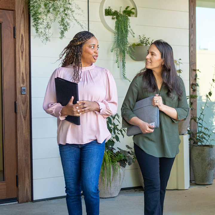 Woman talking to financial advisor about life insurance and small business loans