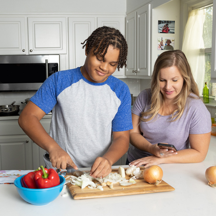 Mother and son prepping food for dinner