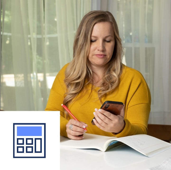 A woman uses our loan cost calculator on her mobile device