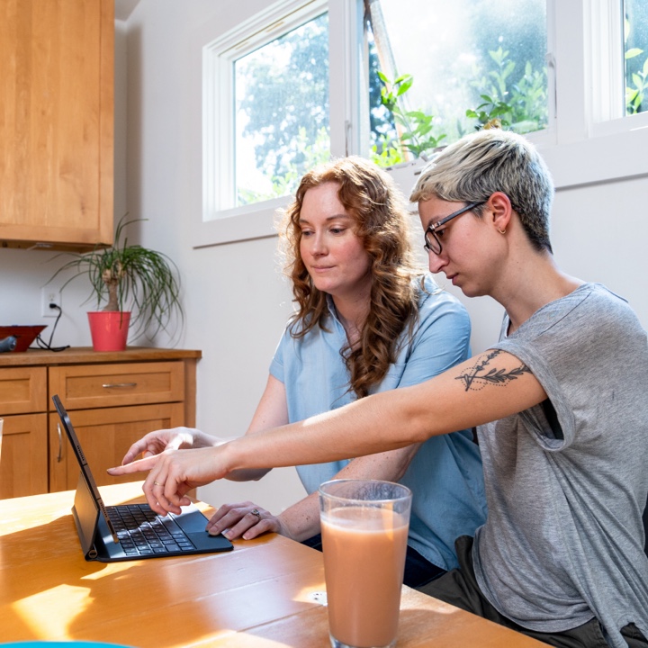 A couple discusses their finances at the dining table