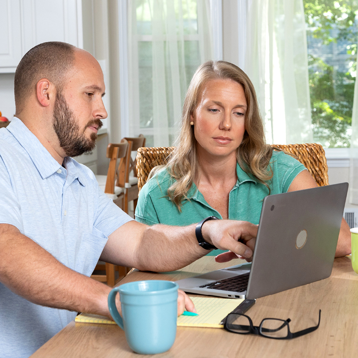 A couple shopping for life insurance online