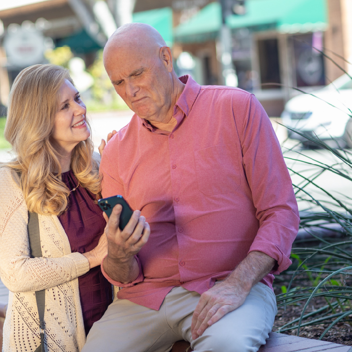 An older couple looking at auto insurance quotes online