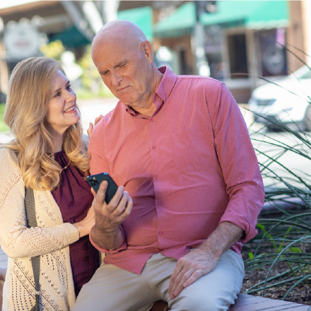 An older couple looking at auto insurance quotes online