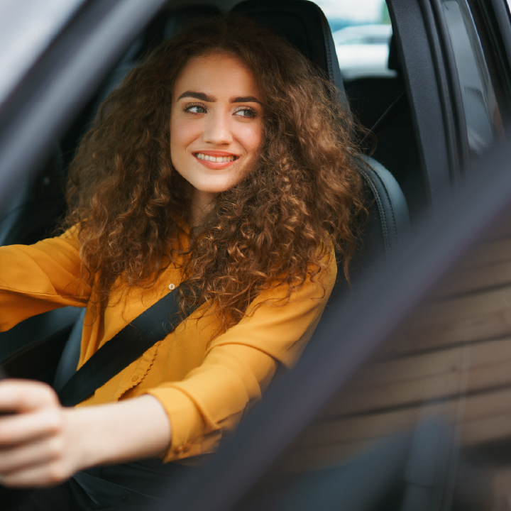 A woman driving her car