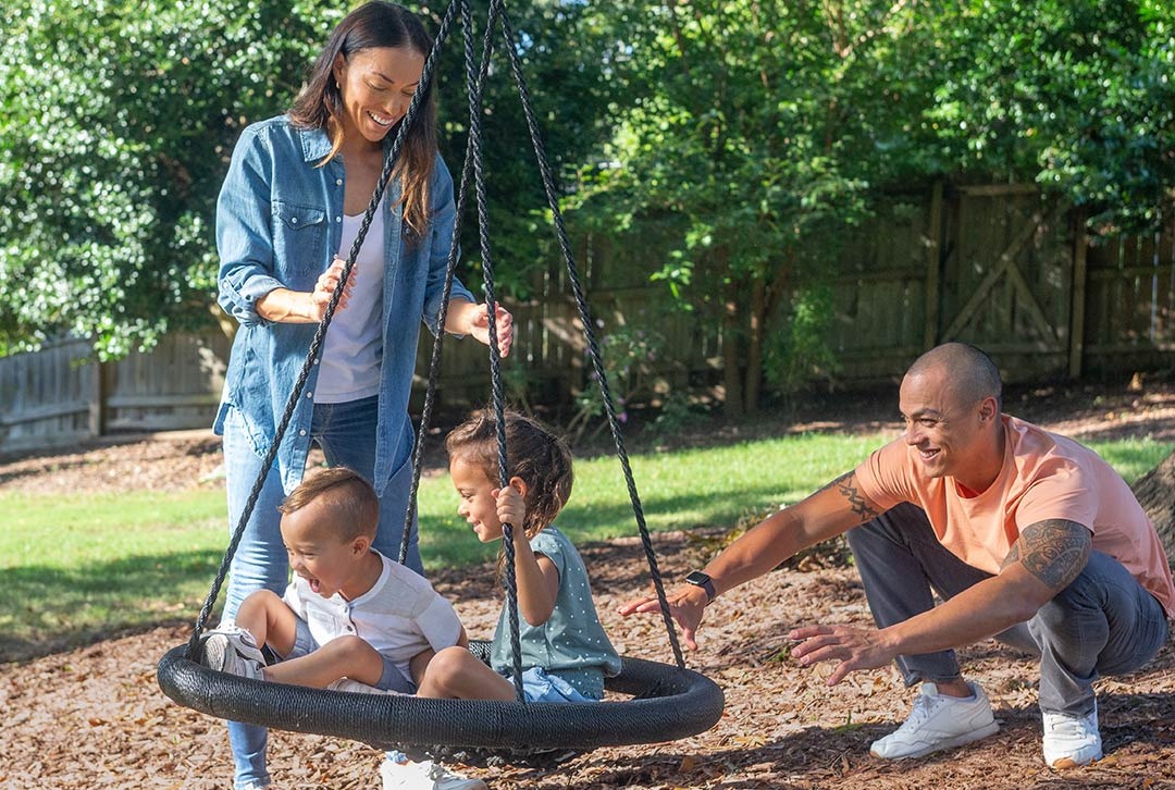 Family on a tire swing