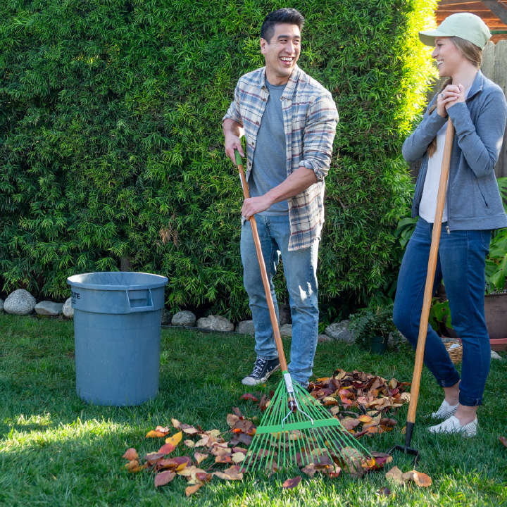 A husband and wife doing yard work