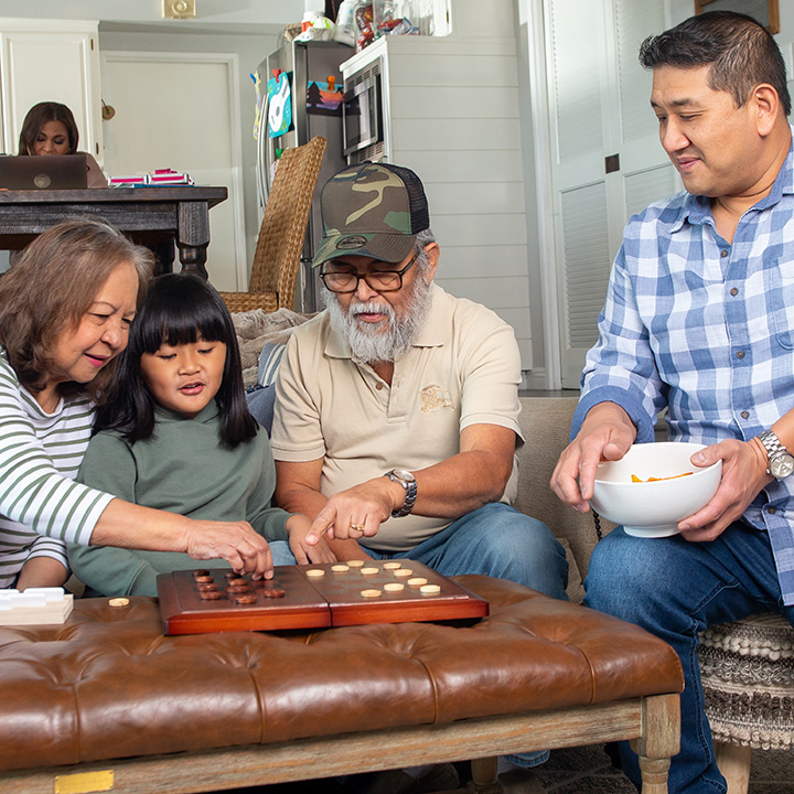 A family playing checkers