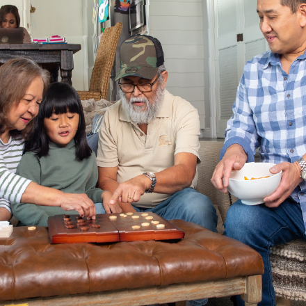 A family playing checkers