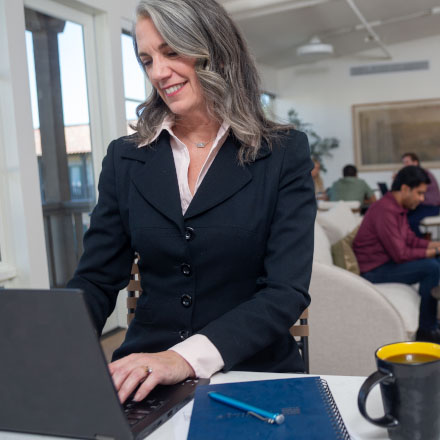A woman using her online account to review her life insurance