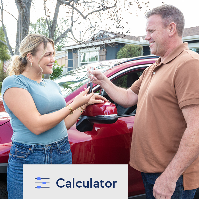 A father giving his daughter keys to her new vehicle