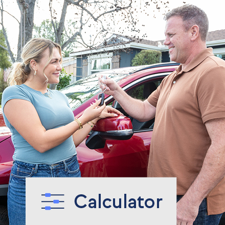 A father giving his daughter keys to her new vehicle