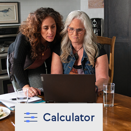 Two women using TruStage's savings goal calculator on a laptop