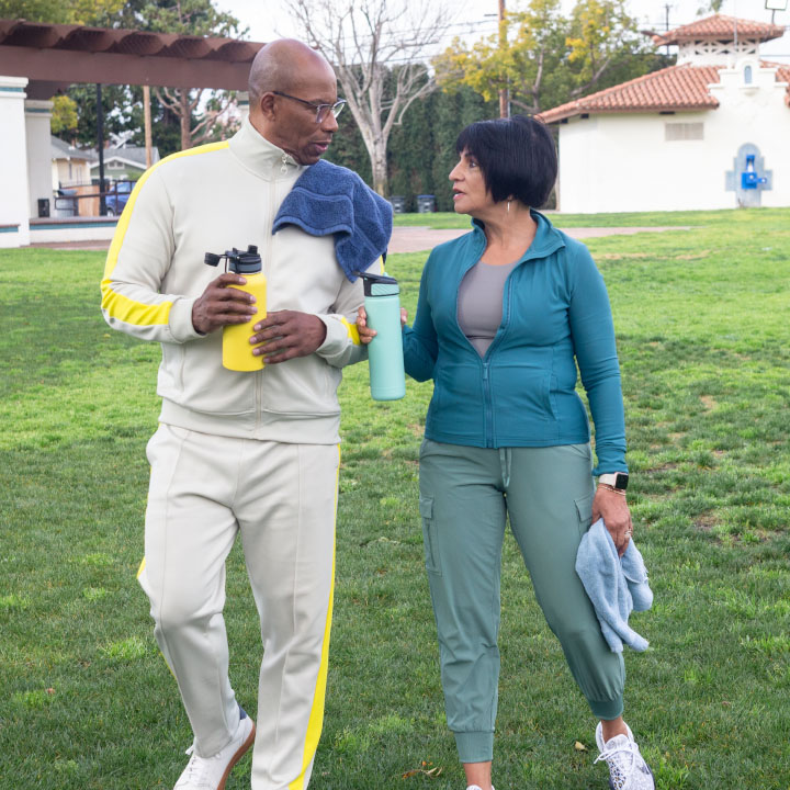 A husband and wife talking after they exercised outside