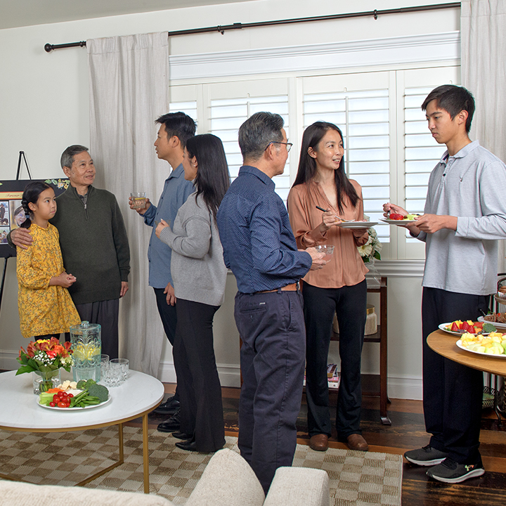 A family talking with each other at a wake