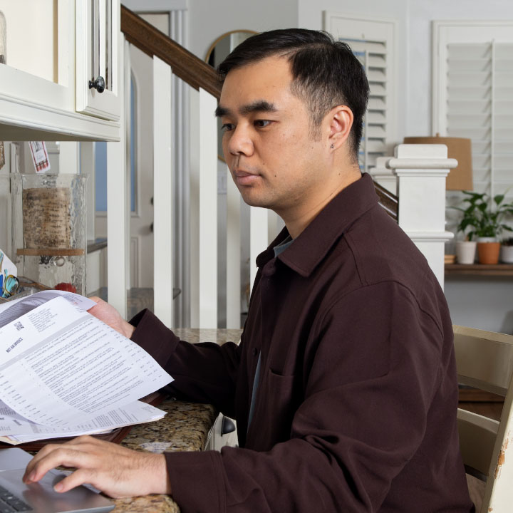 A man reading his life insurance policy