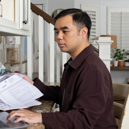 A man reading his life insurance policy