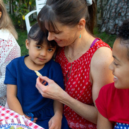 A mother and her young daughter enjoying lunch