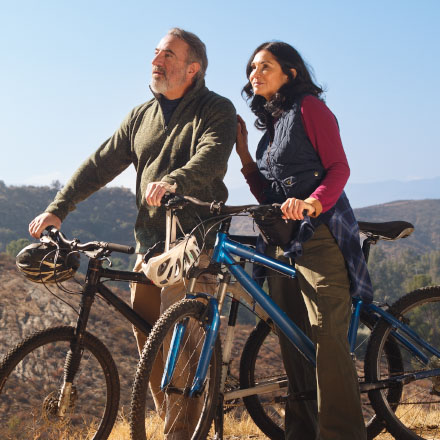 A couple taking a break from riding their bikes