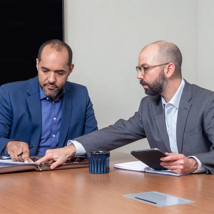 A man and his financial advisor discussing life insurance