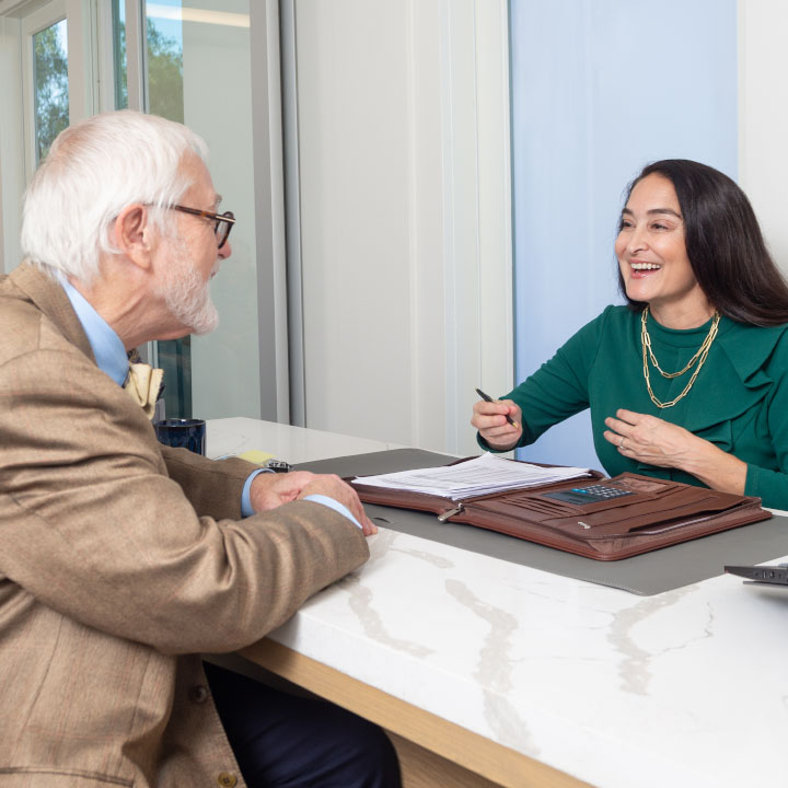 A man talking with his advisor about his life insurance coverage