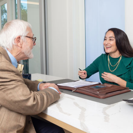 A man talking with his advisor about his life insurance coverage