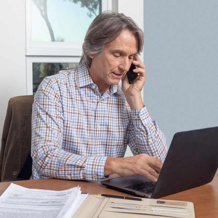 A man looking at his life insurance policy online