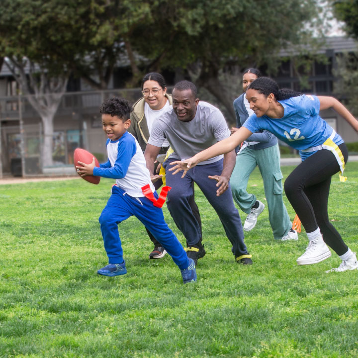 A family playing flag football