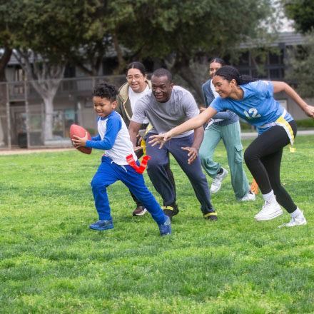 A family playing flag football