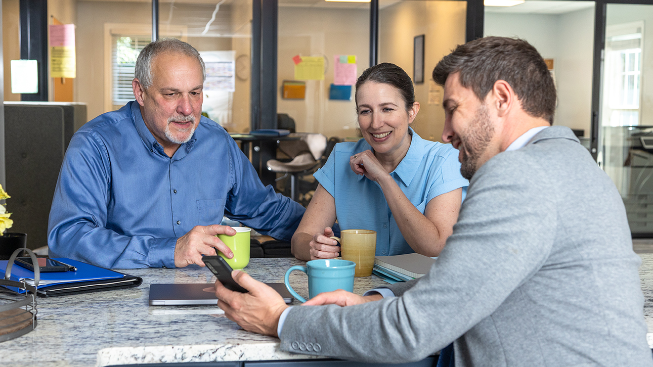 Three coworkers having a meeting