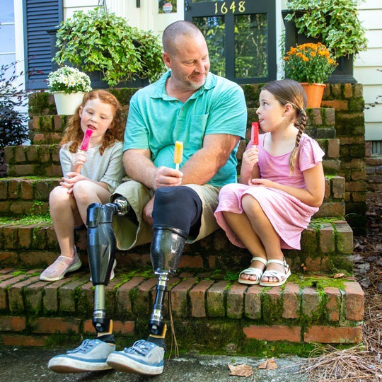 Father with dual prosthesis thankful for his disability insurance coverage so he can share special moments with his daughters