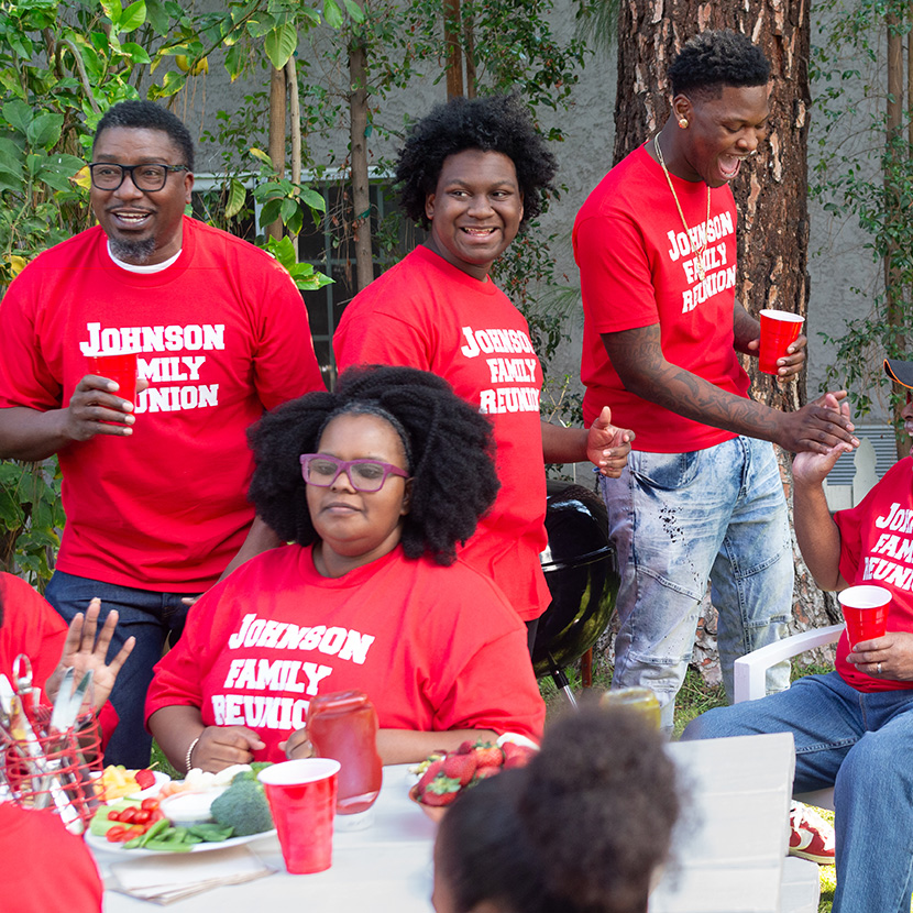 A group of people talking and laughing at a family gathering