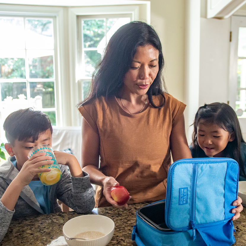 Mother and children packing lunch