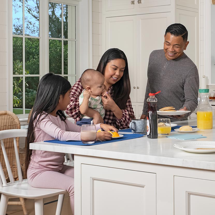 A family enjoying their breakfast knowing they are protected by their TruStage life insurance policy.