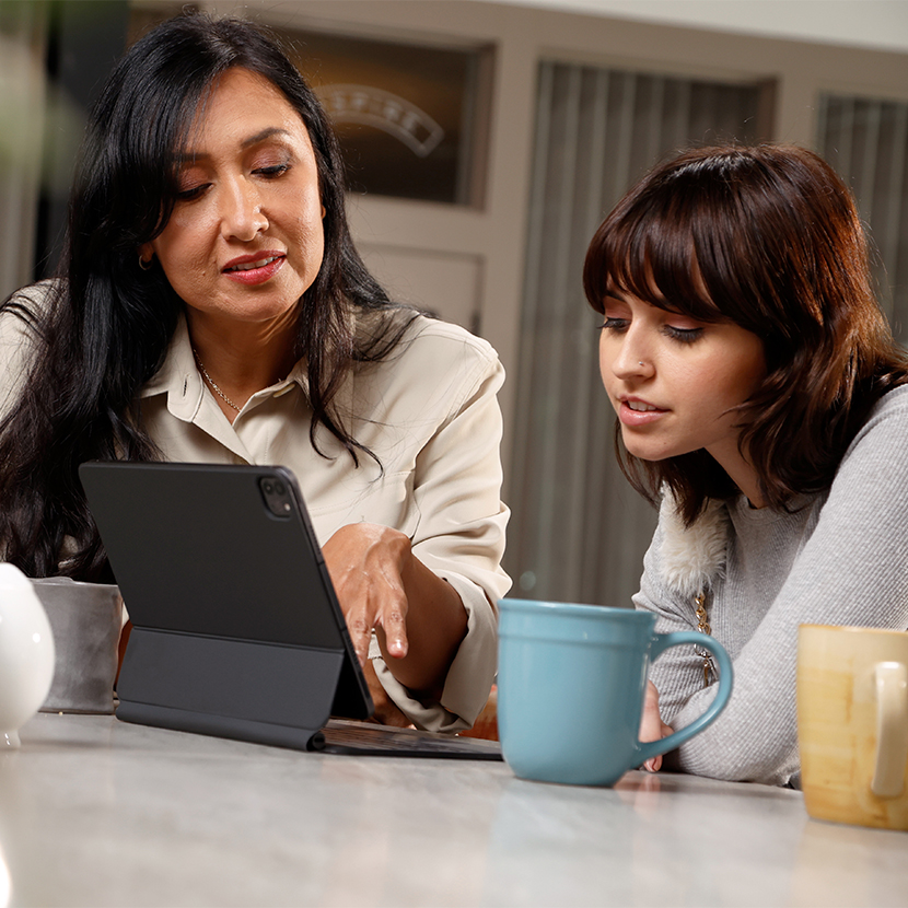 Mother and daughter looking at tablet