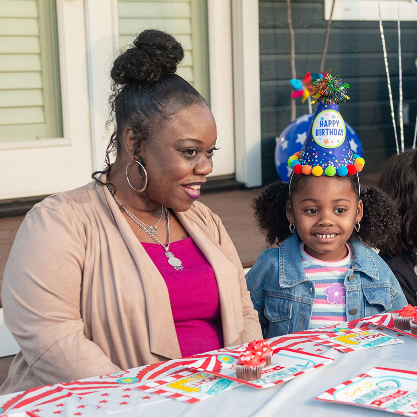 A mother and child celebrate the child's birthday
