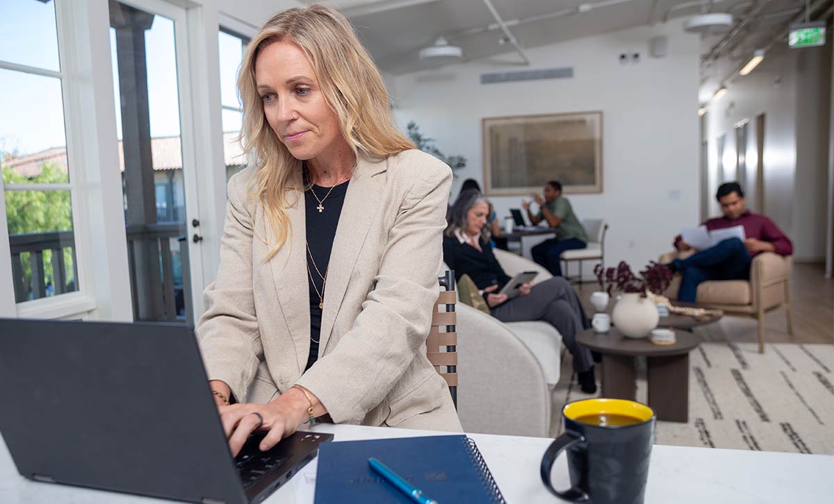 A woman reviews TruStage annuity helpful resources on her laptop