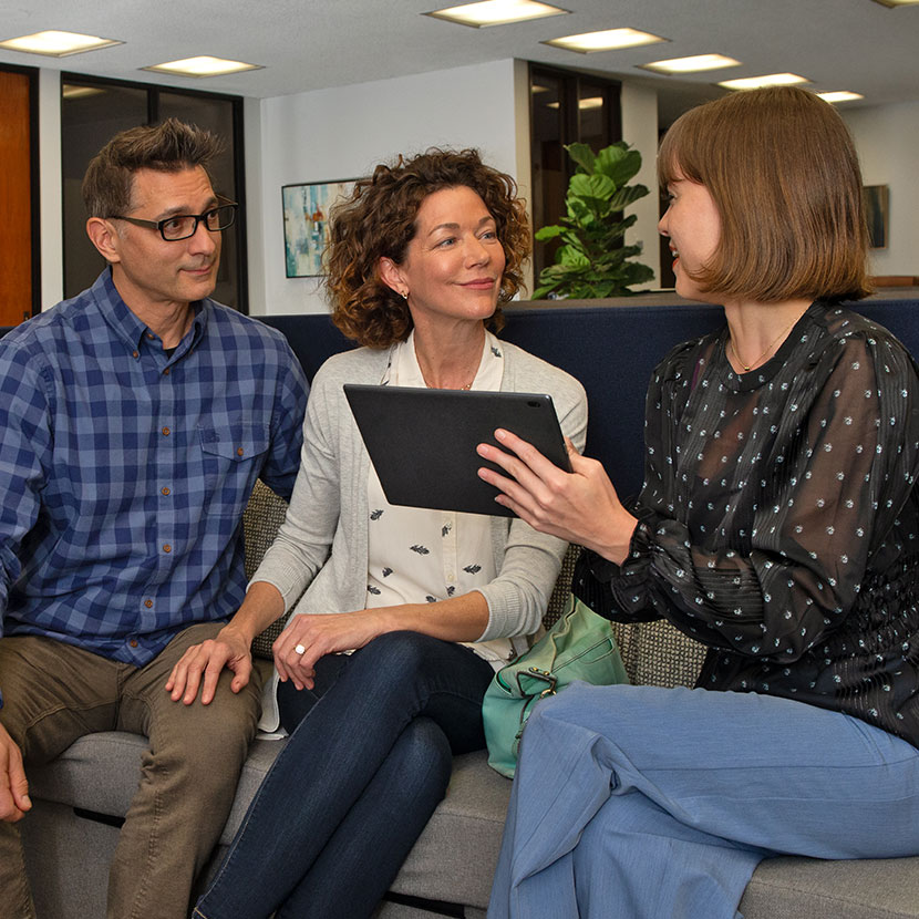 Three people having a discussion