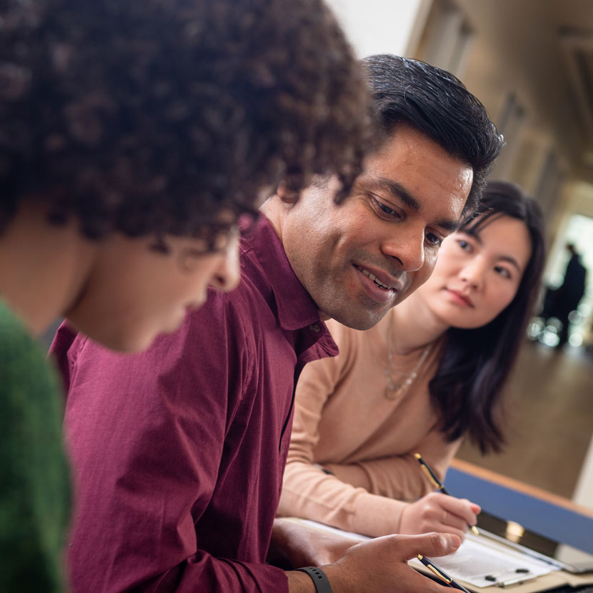 A group of people discuss TruStage cybersecurity protection