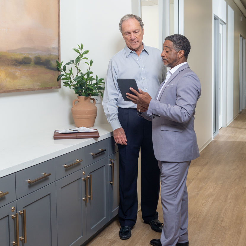 Two men discuss TruStage management and professional liability