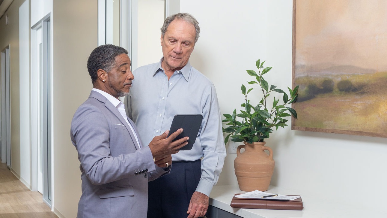 Two men discuss TruStage management and professional liability