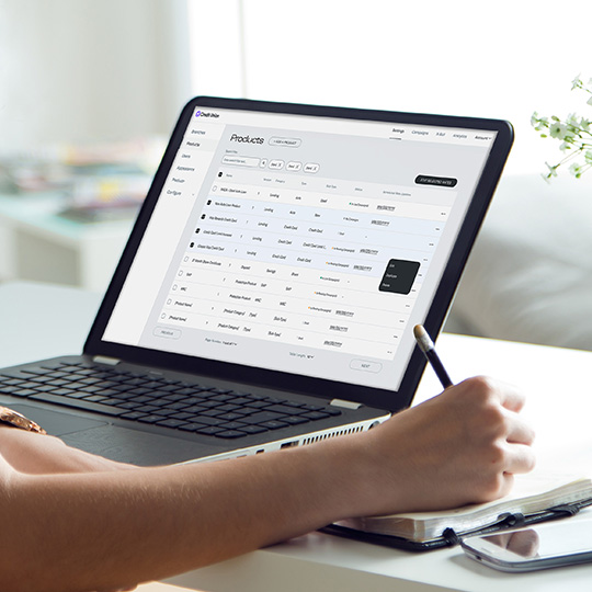 A financial professional takes notes as they customize a Digital Storefront campaign on their laptop.