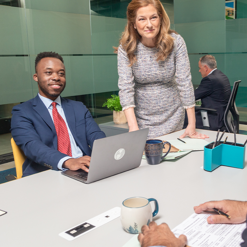 A team of Cuna Mutual Fiduciary Consultants in an office setting